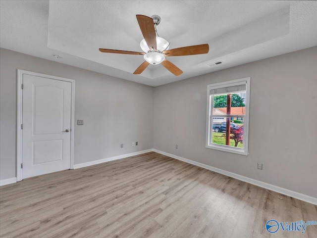 323 Earnhardt Dr, New Market, AL 35761 - empty room featuring wood finished floors, ceiling fan, baseboards, and a textured ceiling