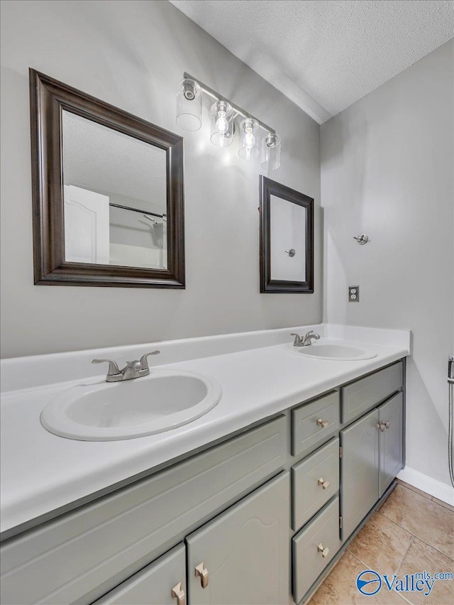 323 Earnhardt Dr, New Market, AL 35761 - bathroom with a textured ceiling and double vanity