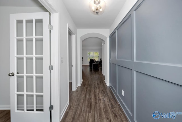 corridor featuring dark hardwood / wood-style flooring