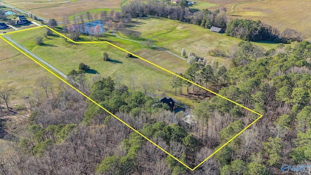birds eye view of property with a rural view