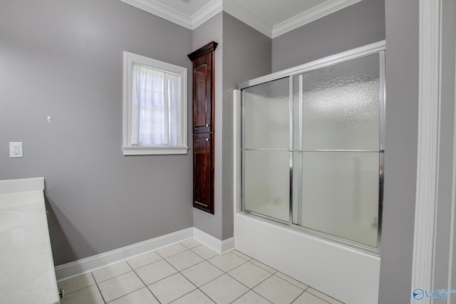 full bathroom featuring tile patterned floors, ornamental molding, combined bath / shower with glass door, baseboards, and vanity