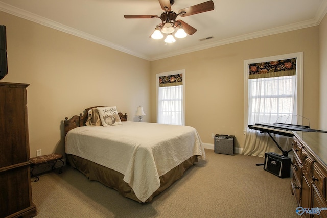 bedroom with ceiling fan, carpet flooring, visible vents, and ornamental molding