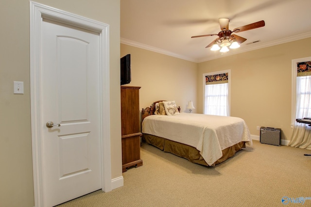 bedroom featuring light carpet, visible vents, multiple windows, and ornamental molding