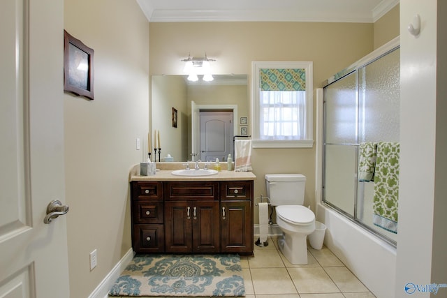 bathroom featuring tile patterned flooring, vanity, toilet, and crown molding