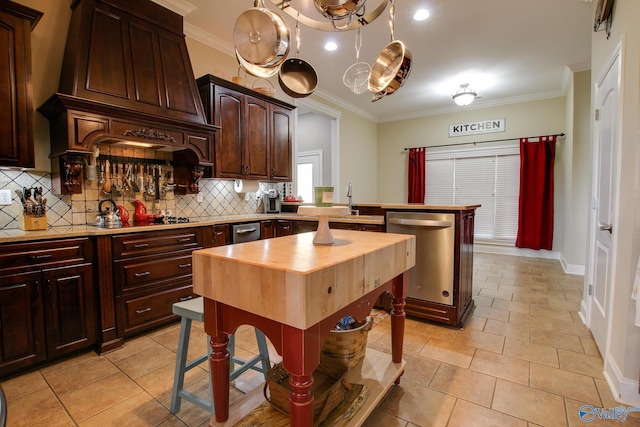 kitchen with a peninsula, dishwasher, crown molding, backsplash, and black stovetop