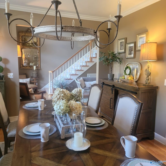 dining area featuring hardwood / wood-style floors and crown molding