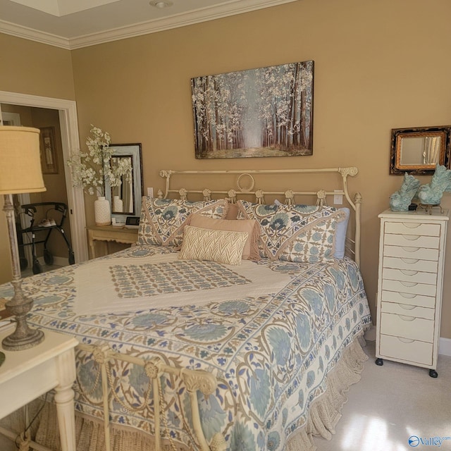 bedroom with crown molding and carpet flooring