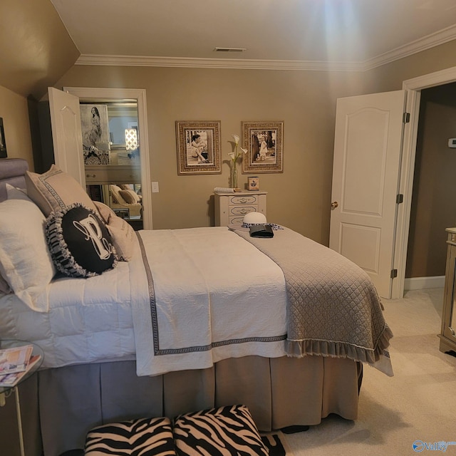 carpeted bedroom featuring crown molding