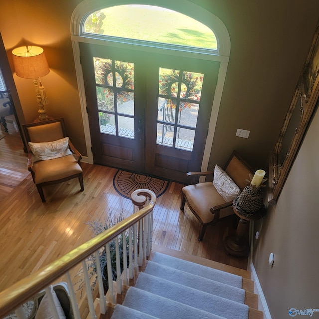 interior space with hardwood / wood-style floors and french doors