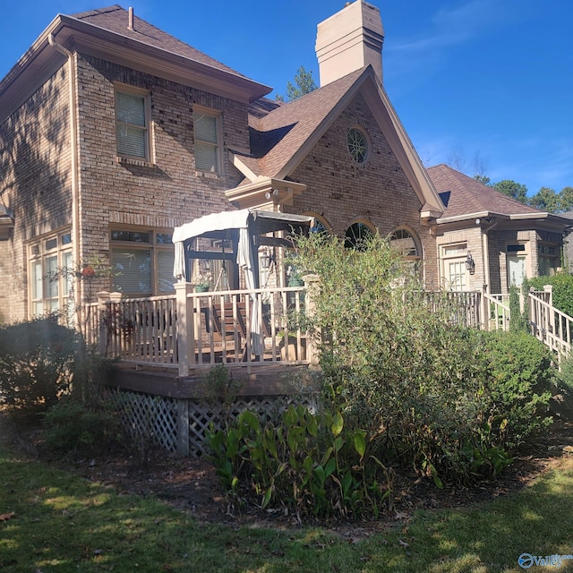 rear view of property with a deck