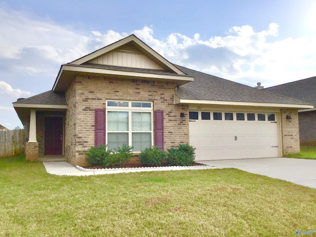 single story home featuring brick siding, a garage, driveway, and a front lawn