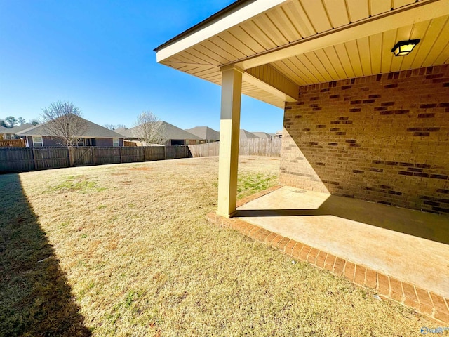 view of yard featuring a patio area and a fenced backyard