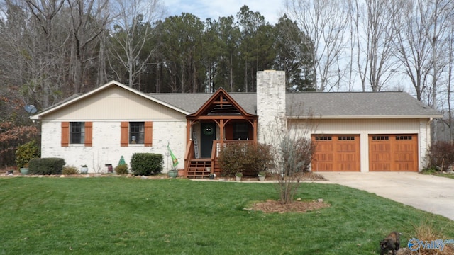 view of front of property with driveway, a chimney, a front lawn, a garage, and crawl space