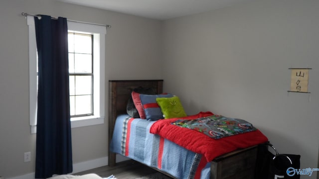 bedroom with wood finished floors