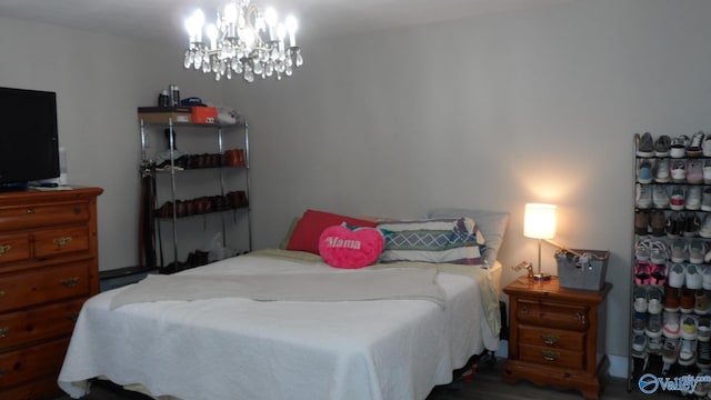 bedroom featuring an inviting chandelier