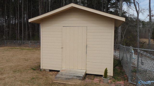 view of shed featuring a fenced backyard