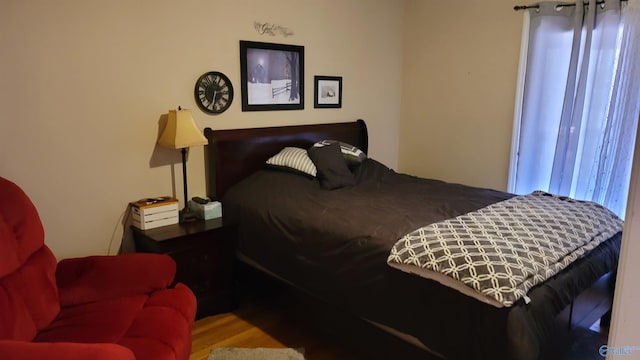 bedroom with wood finished floors