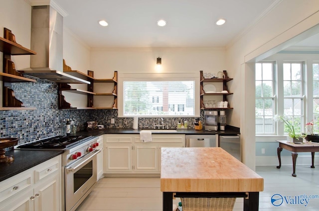 kitchen with crown molding, open shelves, stainless steel appliances, dark countertops, and extractor fan