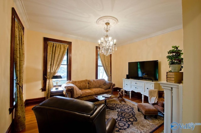 living room with crown molding, baseboards, and wood finished floors