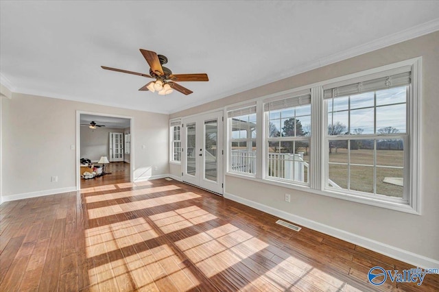 unfurnished sunroom featuring french doors