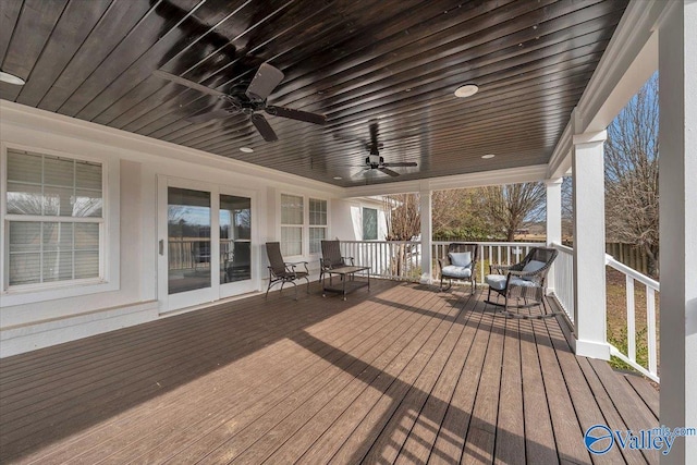 wooden terrace featuring ceiling fan