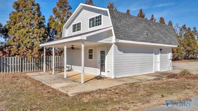 rear view of property with a lawn, ceiling fan, and a patio area