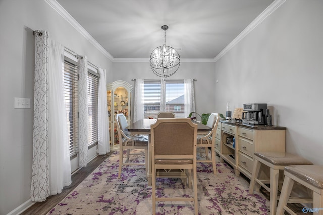 137 Sunlit Grove Dr, Harvest, AL 35749 - dining room featuring a chandelier, ornamental molding, wood finished floors, and baseboards