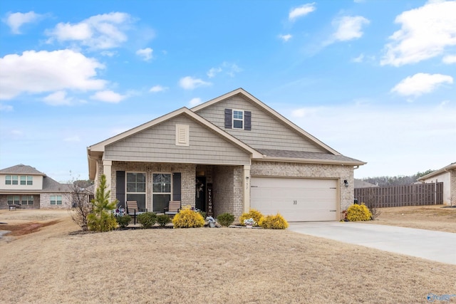 137 Sunlit Grove Dr, Harvest, AL 35749 - view of front of house featuring brick siding, driveway, fence, an attached garage, and a porch