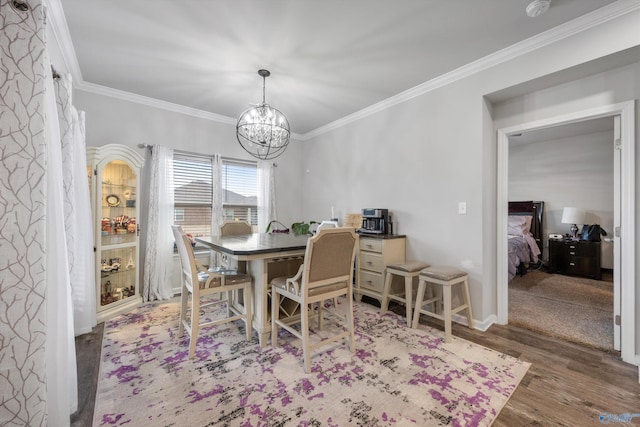 137 Sunlit Grove Dr, Harvest, AL 35749 - dining area featuring wood finished floors, ornamental molding, a chandelier, and baseboards