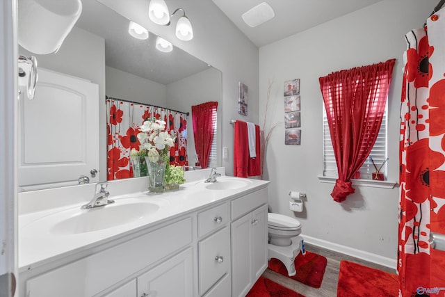 137 Sunlit Grove Dr, Harvest, AL 35749 - full bath featuring toilet, double vanity, and baseboards