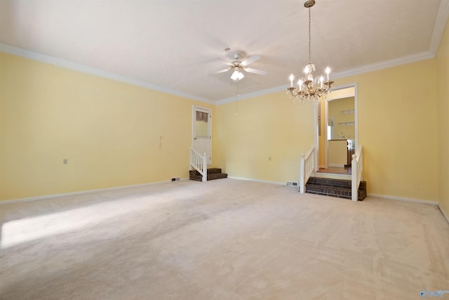 carpeted spare room featuring crown molding and ceiling fan with notable chandelier