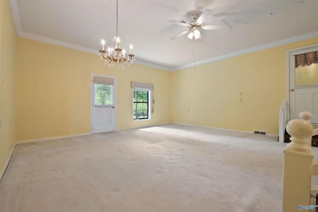 carpeted empty room with ceiling fan with notable chandelier and crown molding