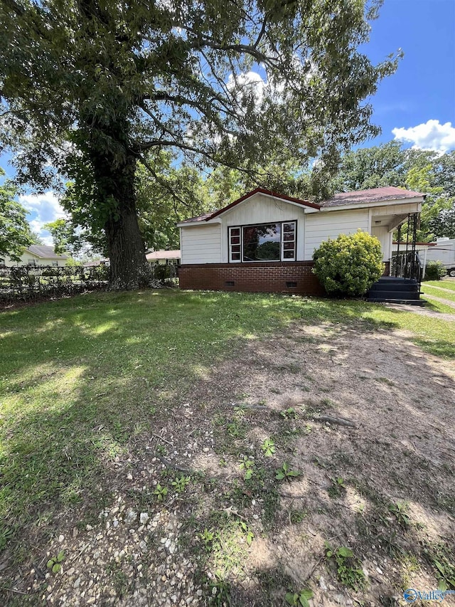 view of property exterior featuring a yard