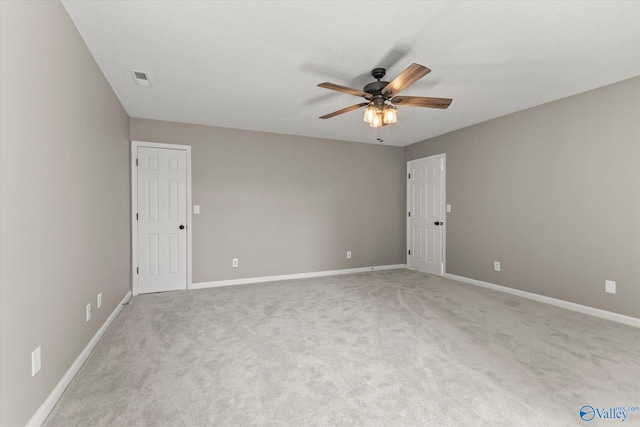 carpeted empty room featuring ceiling fan