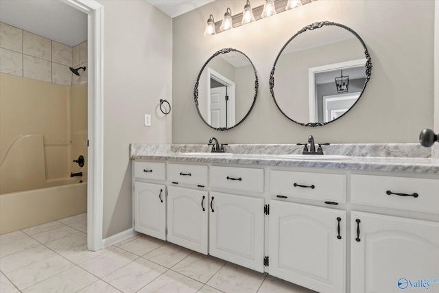 bathroom featuring vanity and shower / bathtub combination