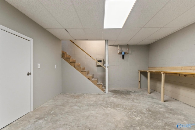 basement featuring a drop ceiling