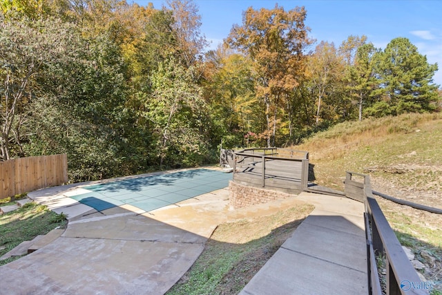 view of pool featuring a patio