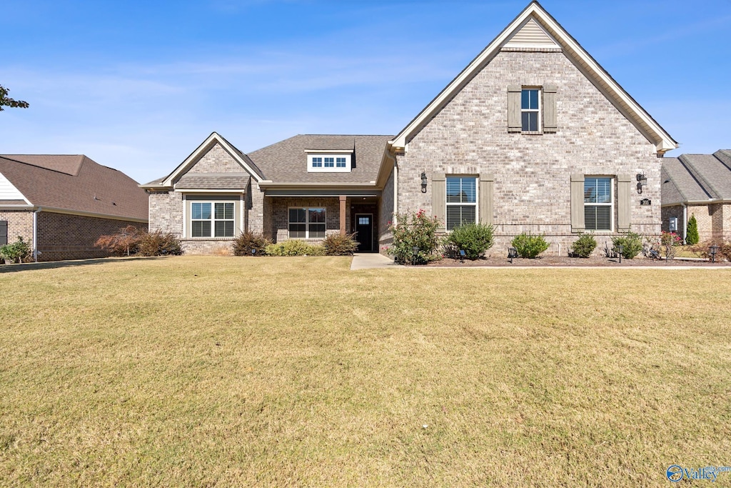 craftsman-style house with a front lawn