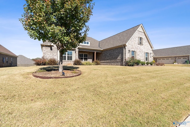 view of front of home featuring a front lawn and a garage