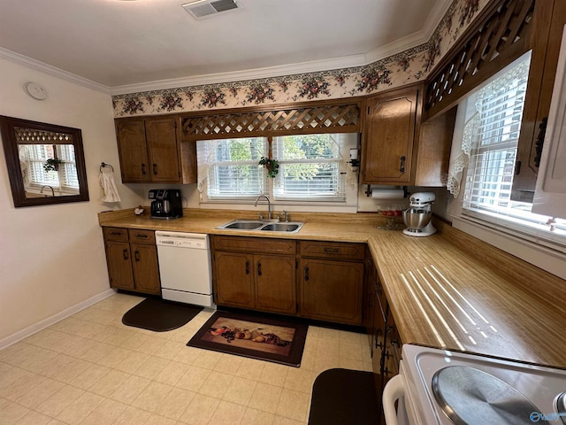 kitchen featuring crown molding, range, sink, and white dishwasher