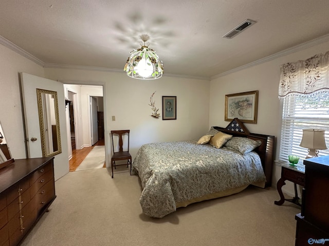 bedroom with ornamental molding and light colored carpet