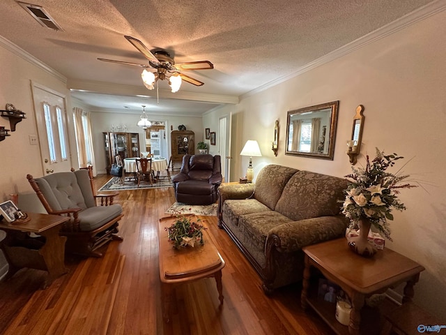 living room with ornamental molding, a textured ceiling, dark wood-type flooring, and ceiling fan