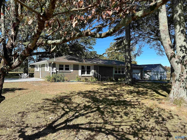 rear view of house featuring a yard