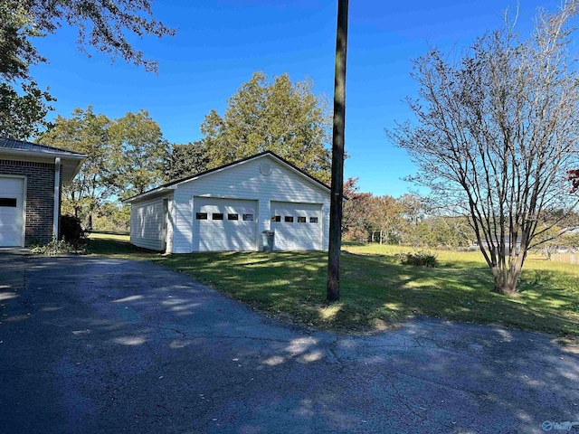 garage with a lawn