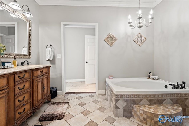 bathroom with a chandelier, vanity, ornamental molding, and tiled tub