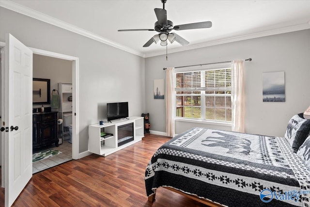 bedroom with crown molding, dark hardwood / wood-style floors, and ceiling fan