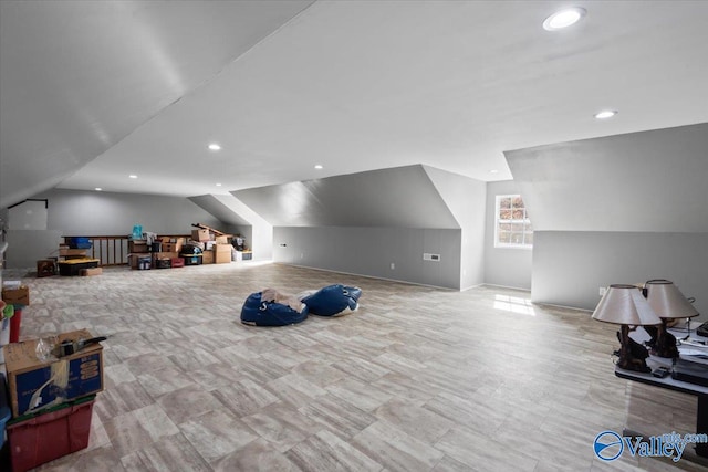 bonus room featuring vaulted ceiling