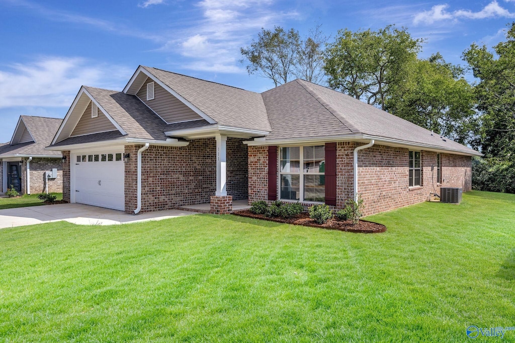 view of front of home with central AC and a front yard