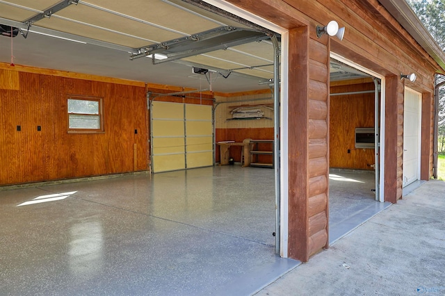 garage featuring wood walls