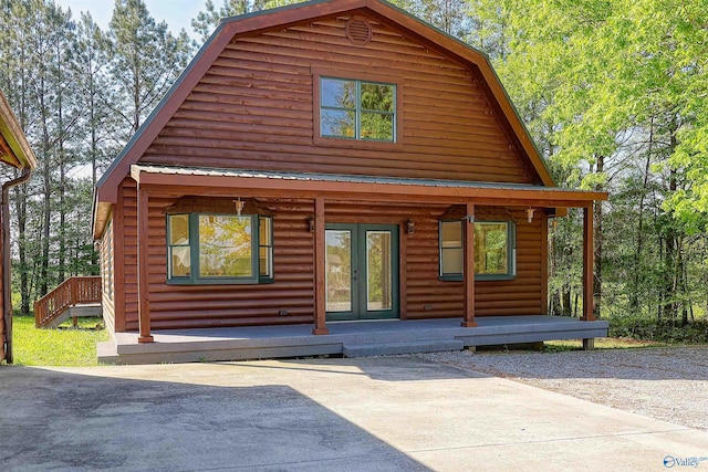 log cabin featuring a porch